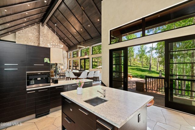 a kitchen with a stove a sink and a refrigerator