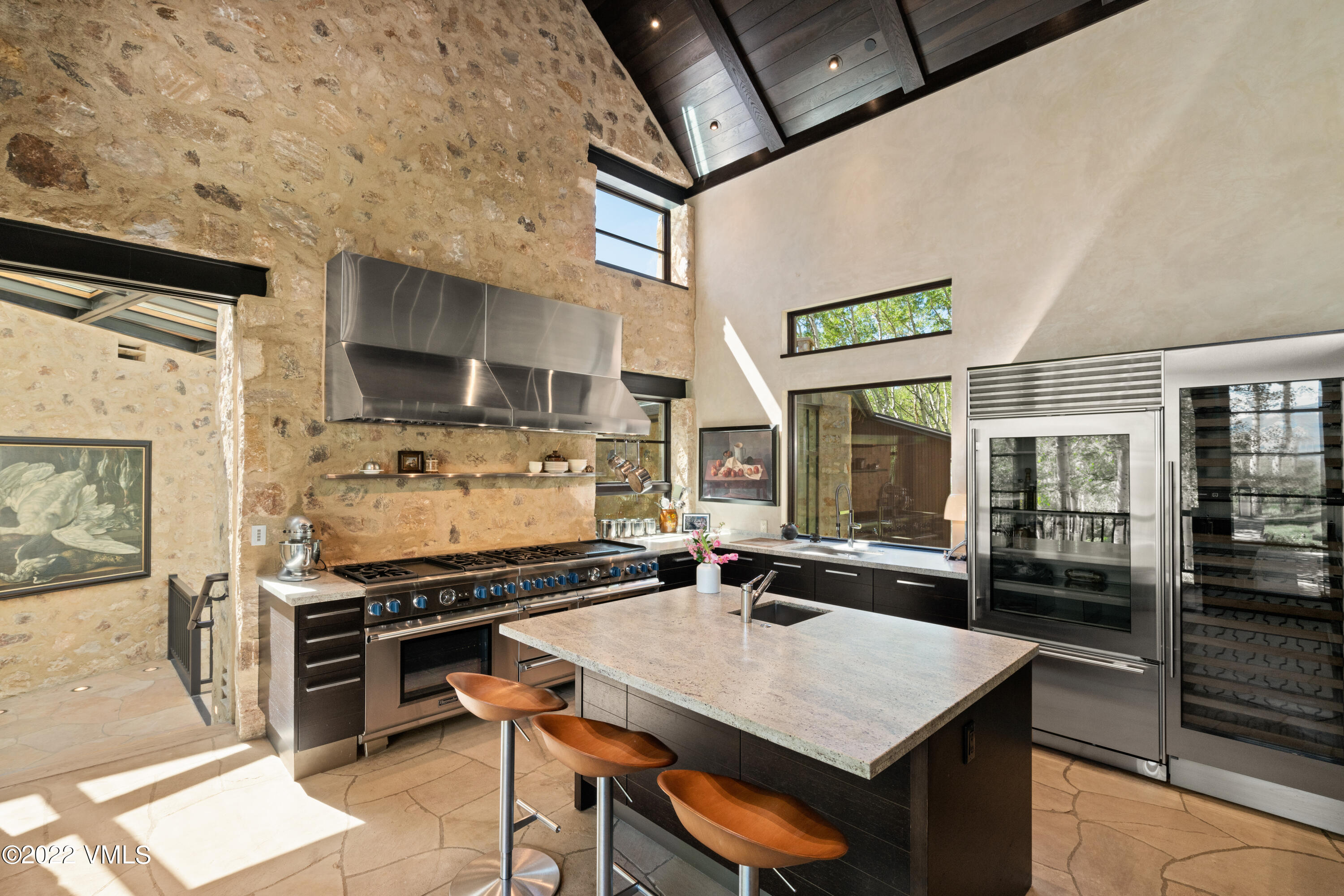 275 Wildrose Avon, CO 81620 - Photo 20 of 44 a kitchen with stainless steel appliances a stove a sink dishwasher and a refrigerator