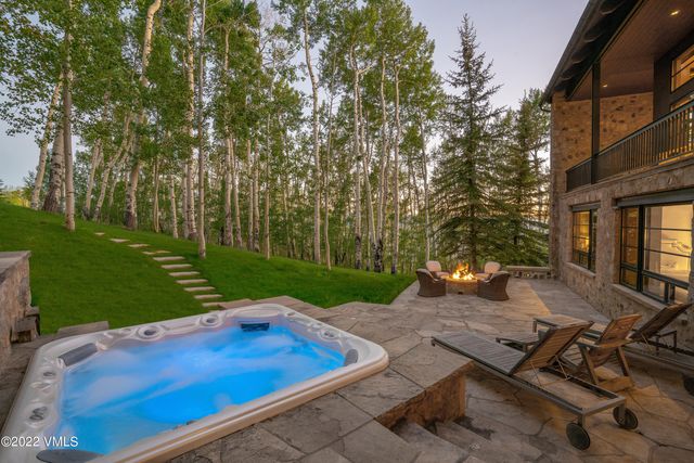 a view of a backyard with sitting area