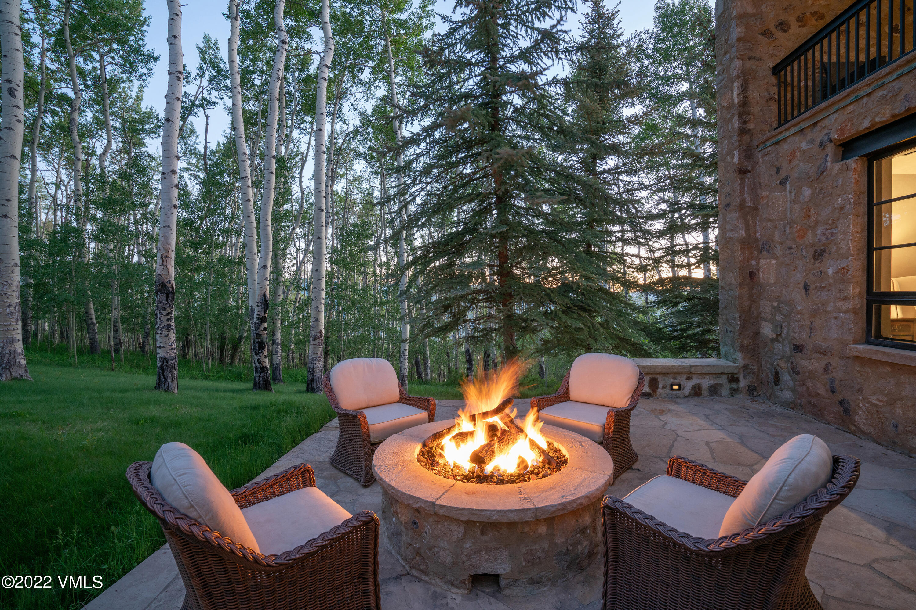 275 Wildrose Avon, CO 81620 - Photo 26 of 44 a backyard of a house with a fountain table and chairs