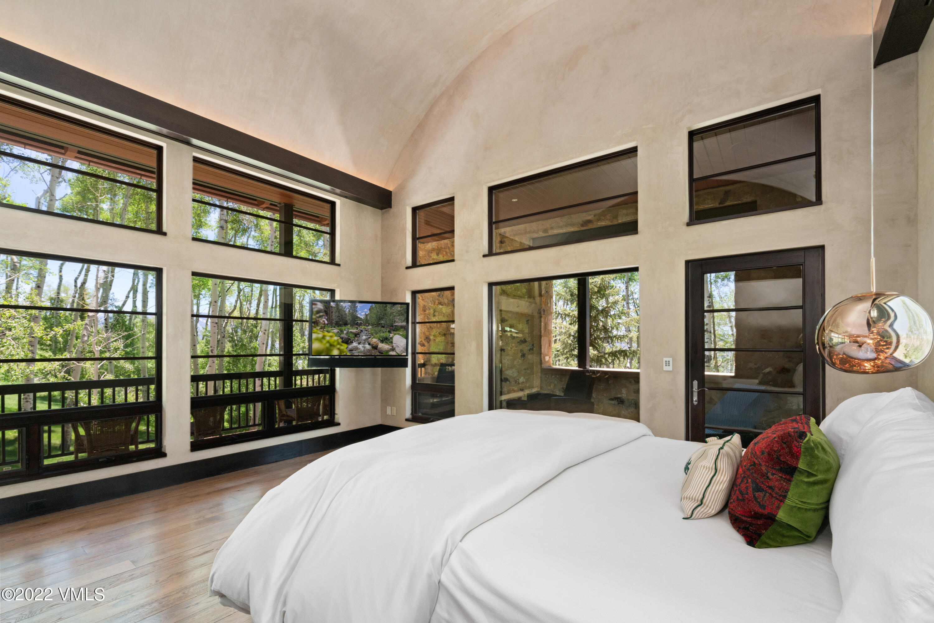 275 Wildrose Avon, CO 81620 - Photo 28 of 44 a bedroom with a bed and a large window