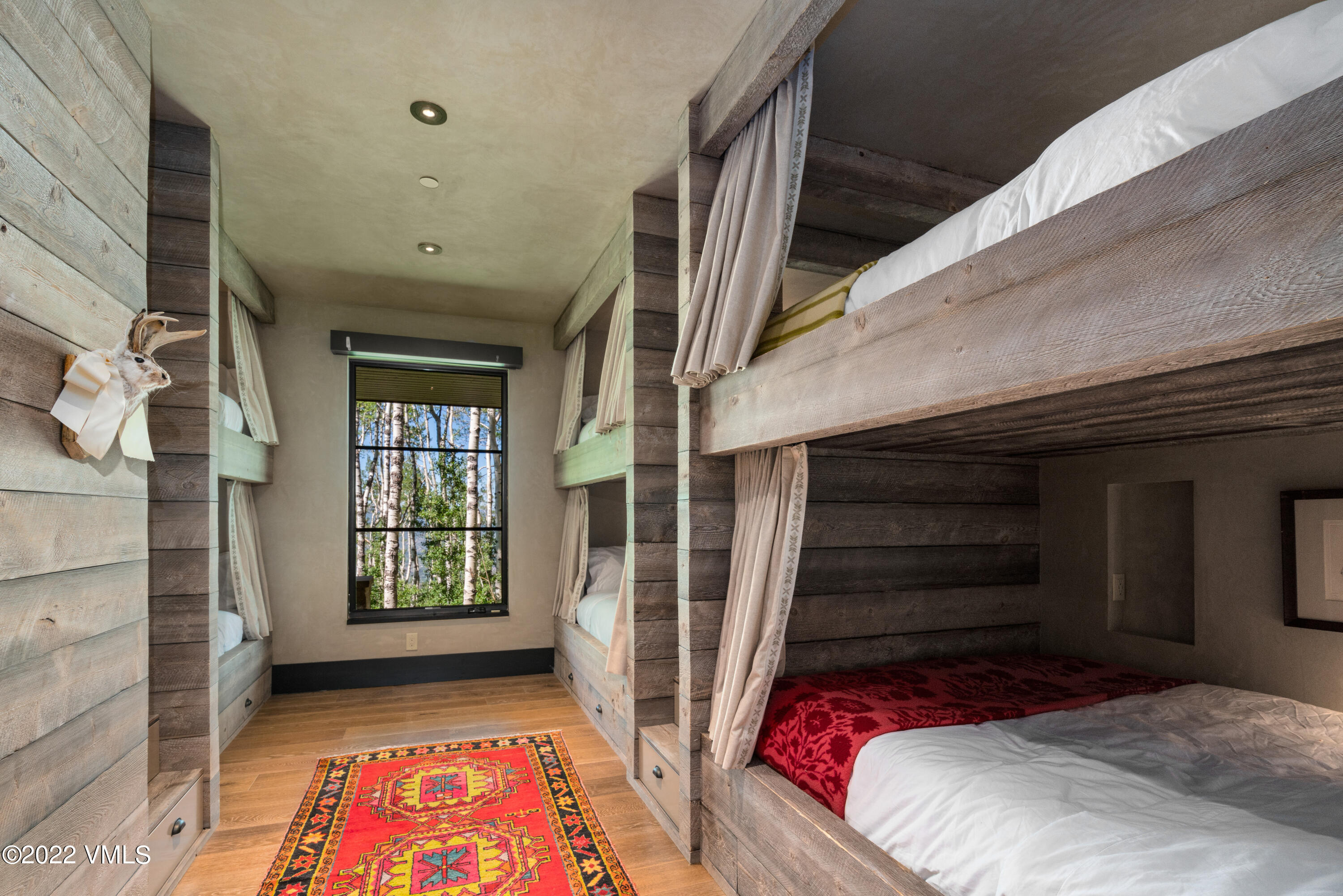 275 Wildrose Avon, CO 81620 - Photo 36 of 44 a bedroom with a bed and a window