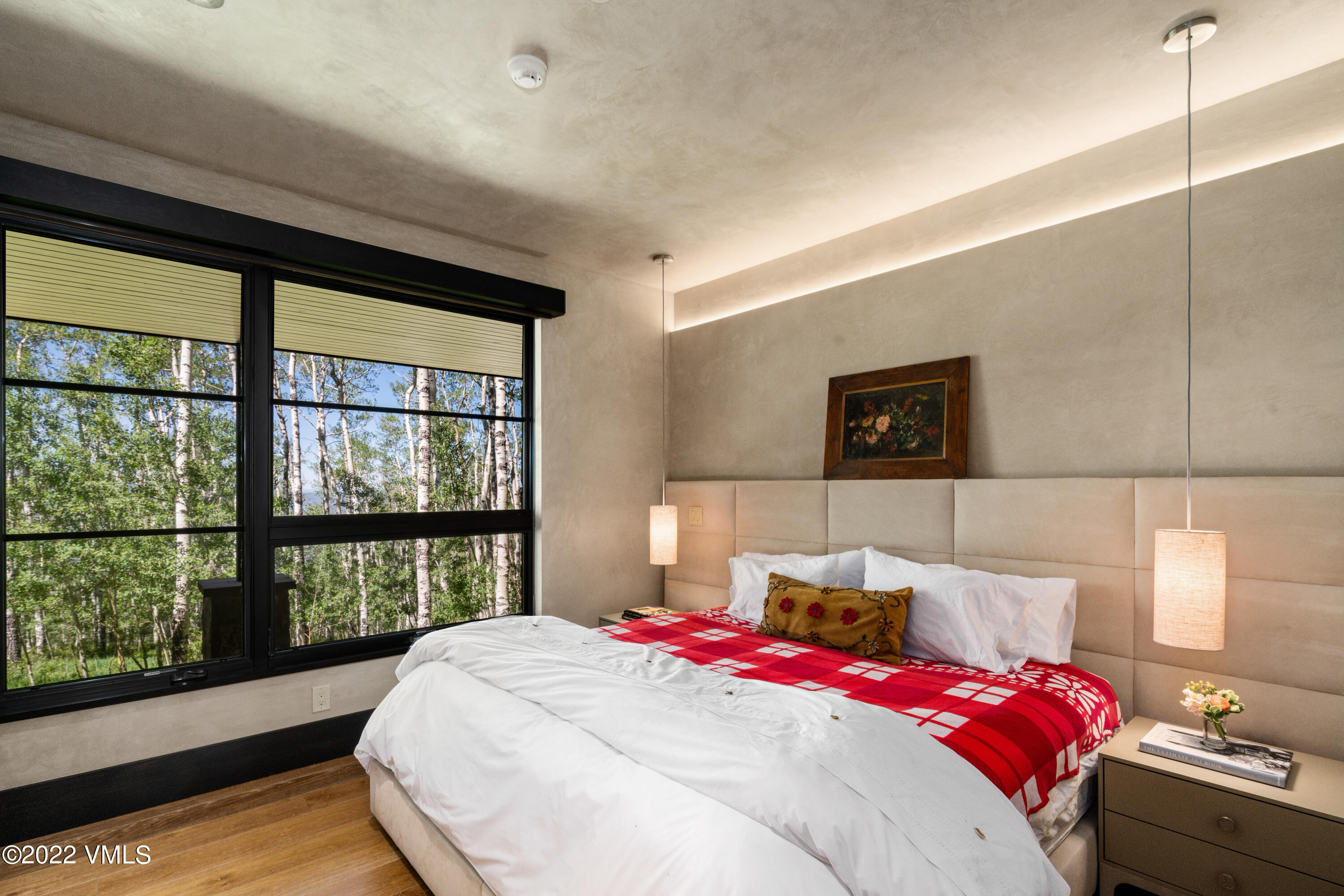 275 Wildrose Avon, CO 81620 - Photo 39 of 44 a bed sitting in a bedroom next to a window