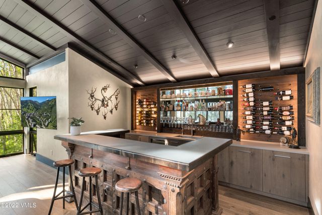 a kitchen with a table and chairs