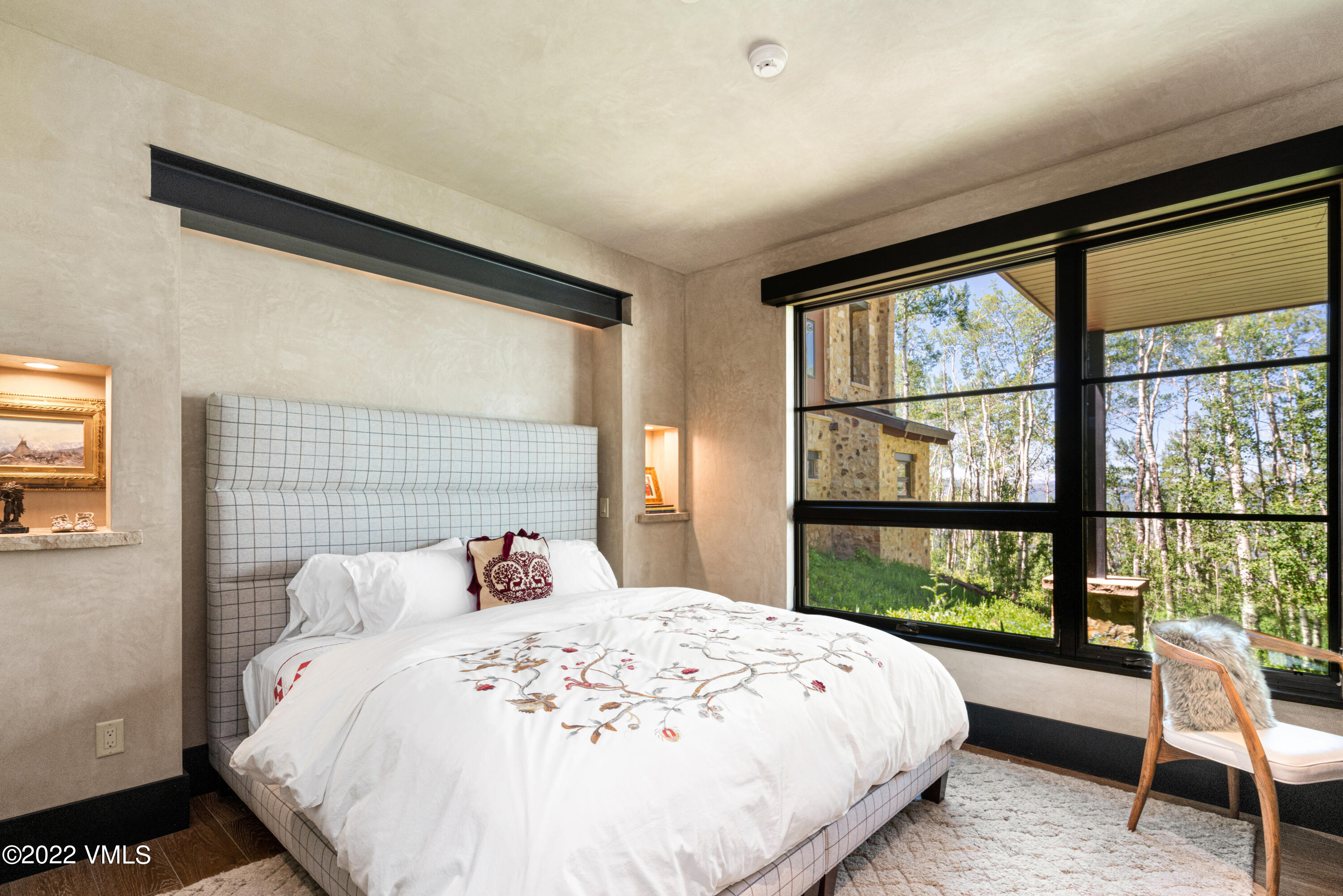 275 Wildrose Avon, CO 81620 - Photo 41 of 44 a bedroom with a large bed and a large window