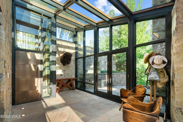 a room with furniture and a floor to ceiling window