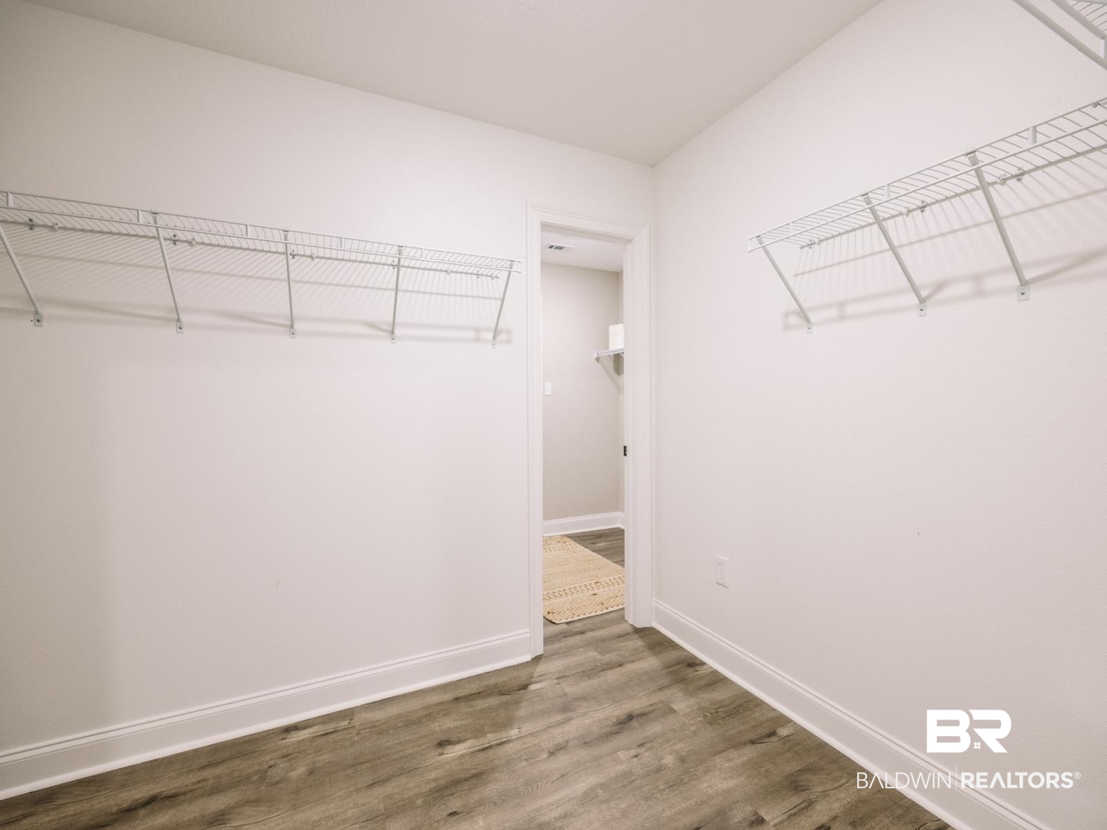 23911 Peppermint Street Elberta, AL 36530 - Photo 11 of 18 Walk in closet with wood finished floors