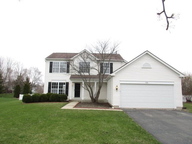 a view of a yard in front view of a house