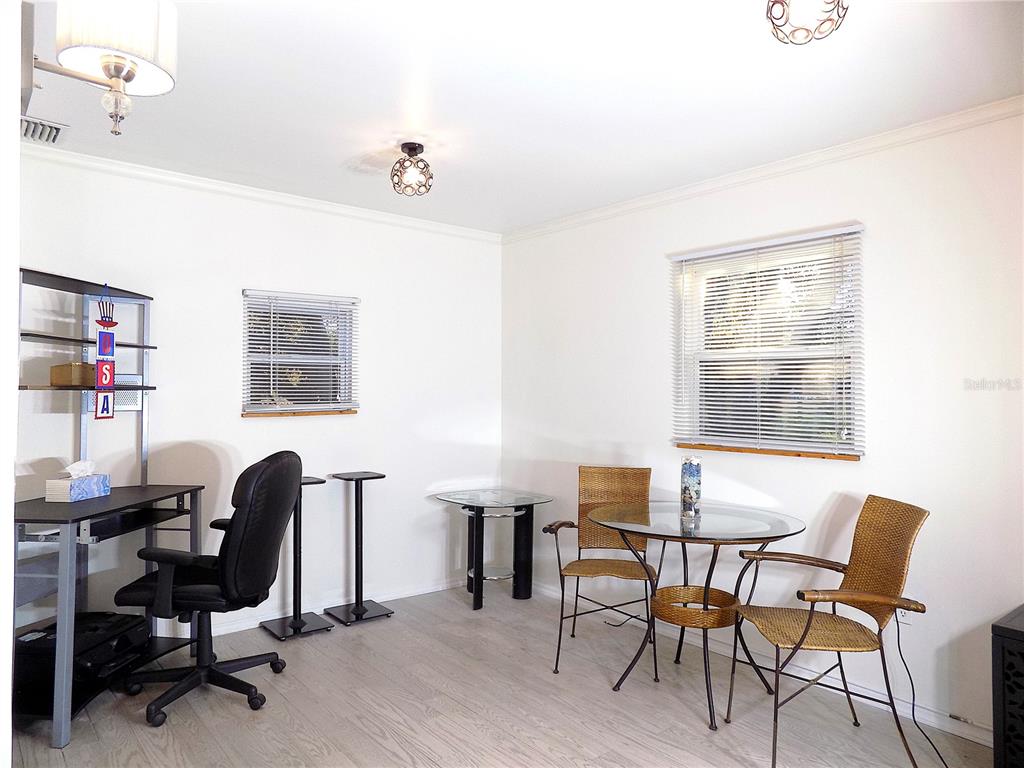 7344 Como Drive New Port Richey, FL 34655 - Photo 16 of 34 a workspace with furniture and a window