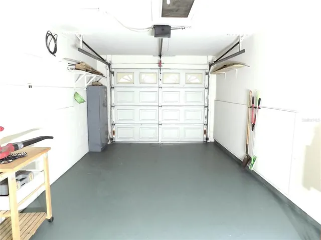 a view of a room with window and a ceiling fan