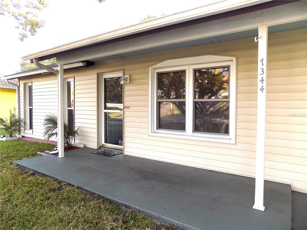 7344 Como Drive New Port Richey, FL 34655 - Photo 29 of 34 a front view of a house with a yard