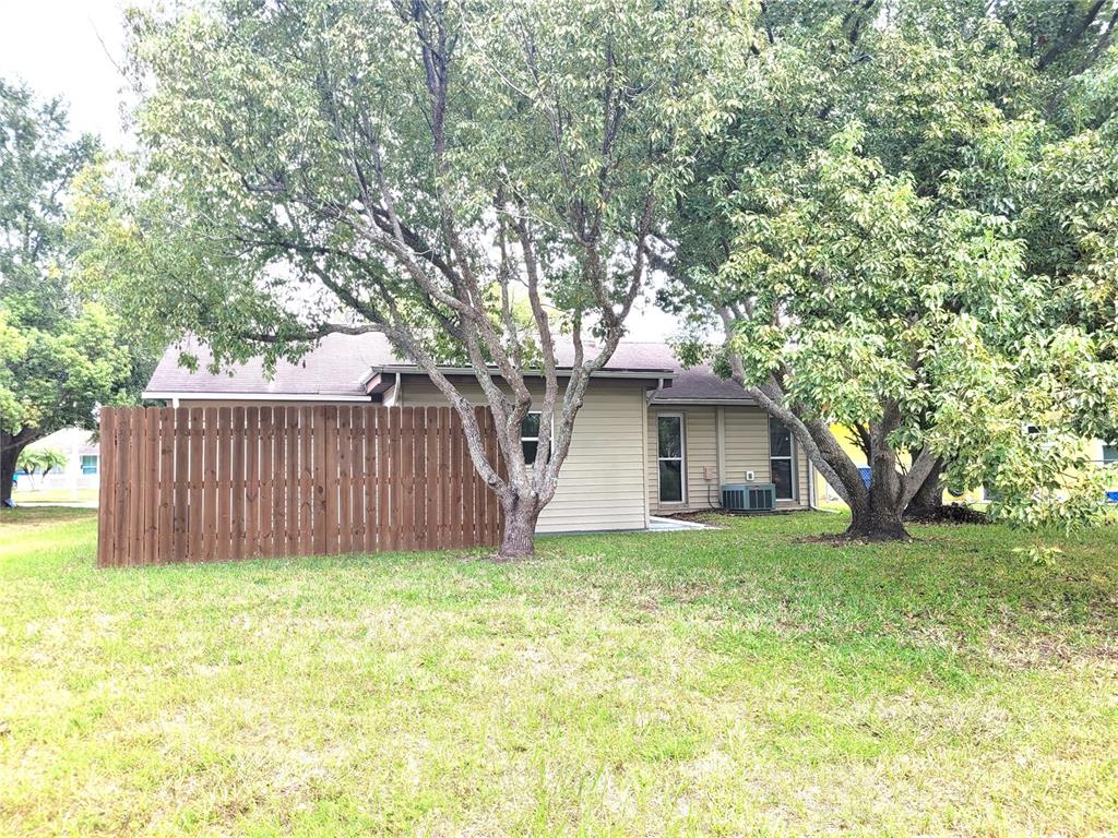 7344 Como Drive New Port Richey, FL 34655 - Photo 33 of 34 a yellow house in middle of the forest