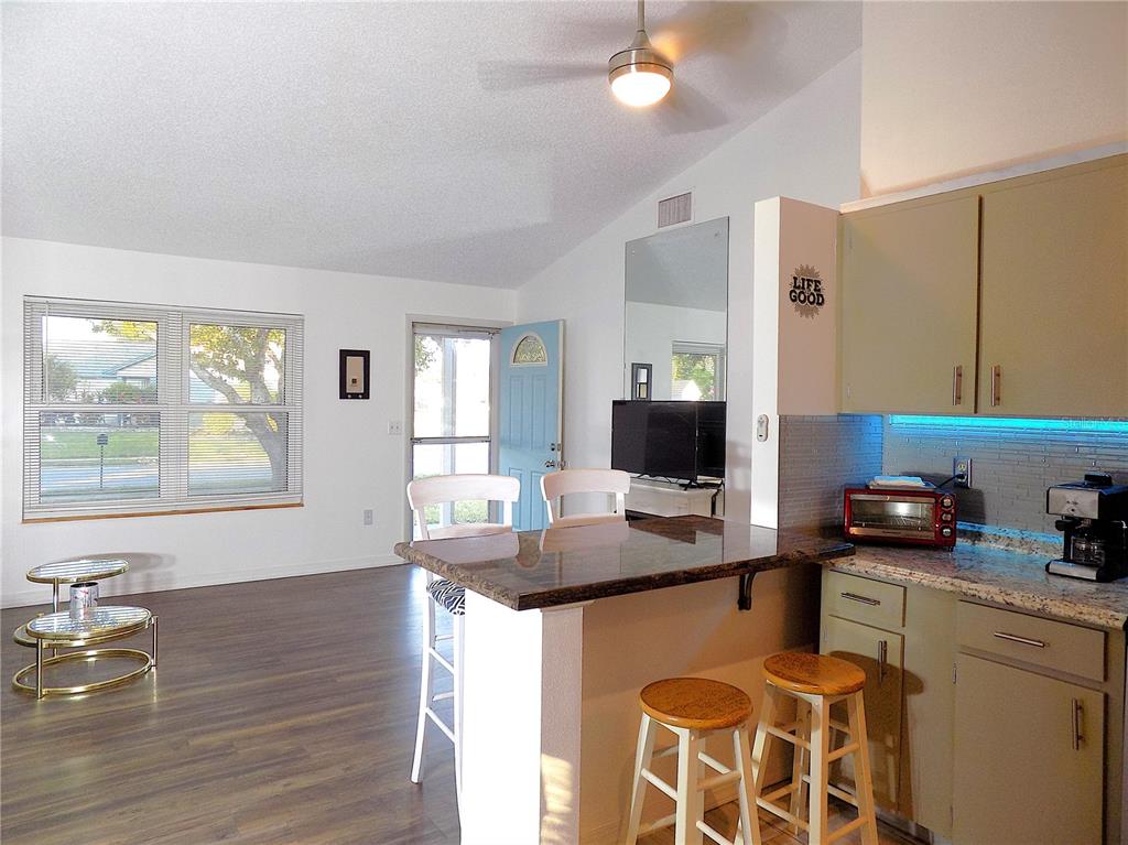 7344 Como Drive New Port Richey, FL 34655 - Photo 5 of 34 a kitchen with a sink stove and microwave