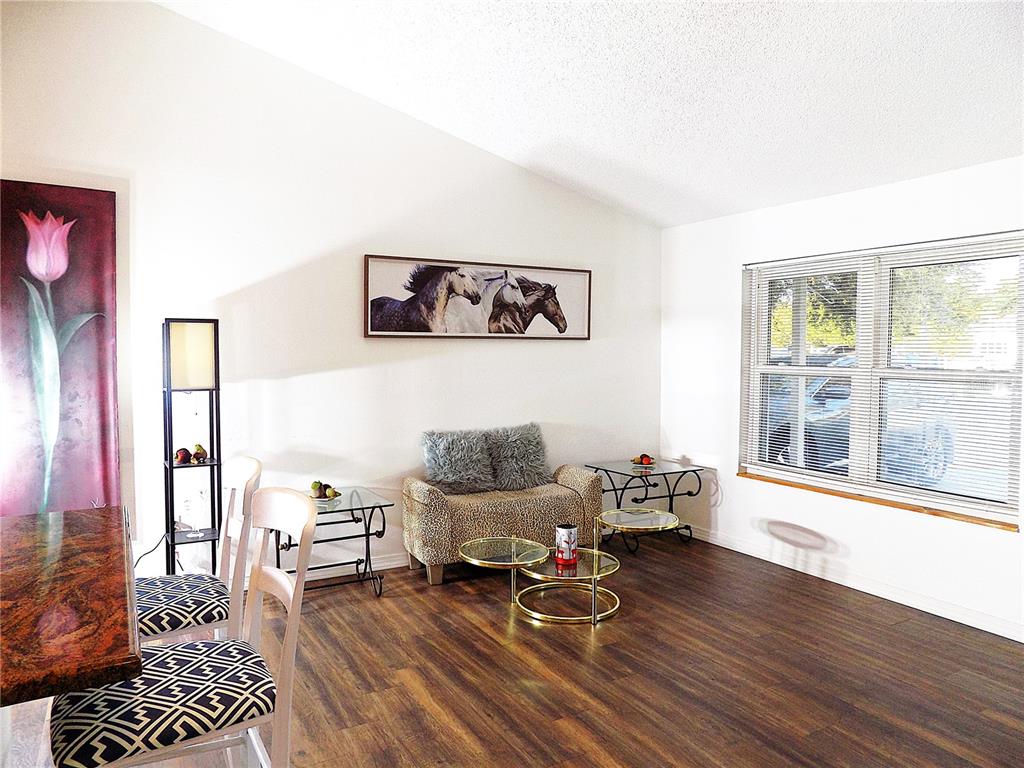7344 Como Drive New Port Richey, FL 34655 - Photo 8 of 34 a living room with furniture and a floor to ceiling window