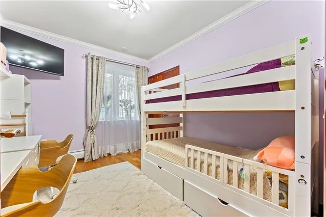 a bedroom with furniture and a window