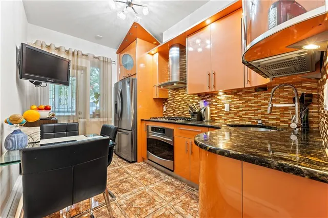 a dining room with furniture and a flat screen tv