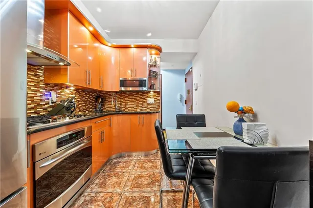 a city view from a dining room with furniture