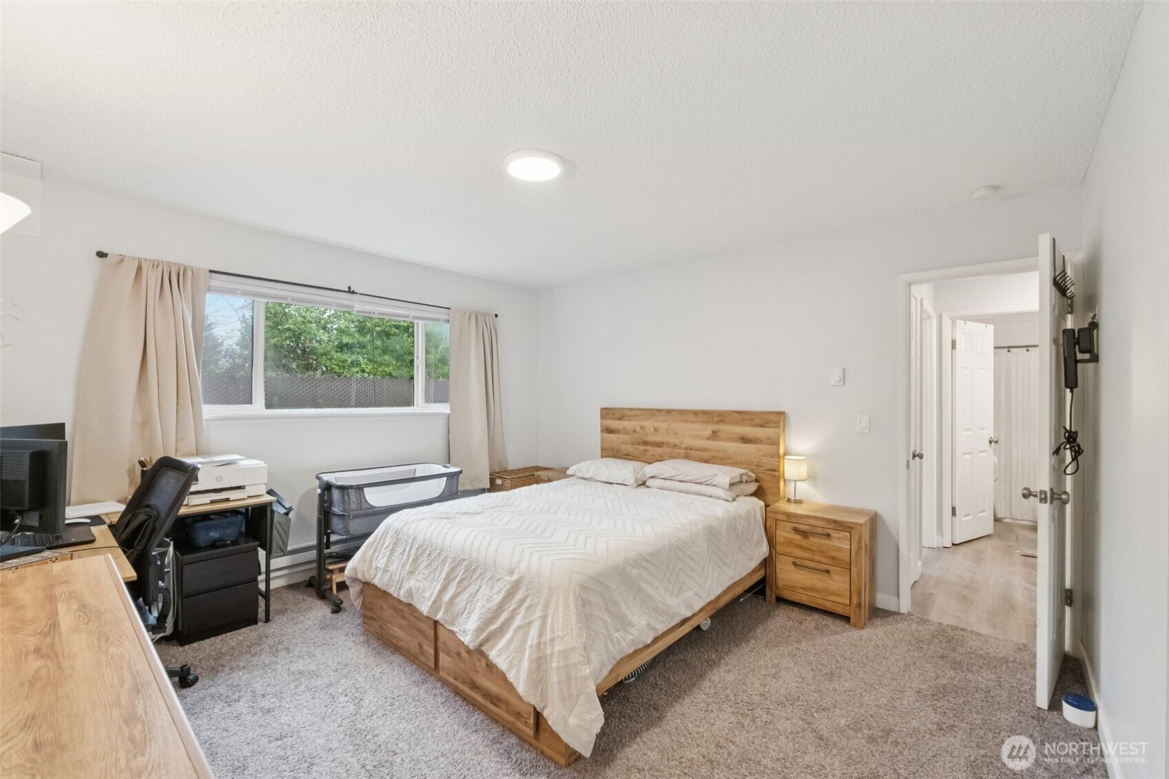 9623 South 248th Street, Unit G5 Kent, WA 98030 - Photo 11 of 23 a bedroom with a bed and a couch