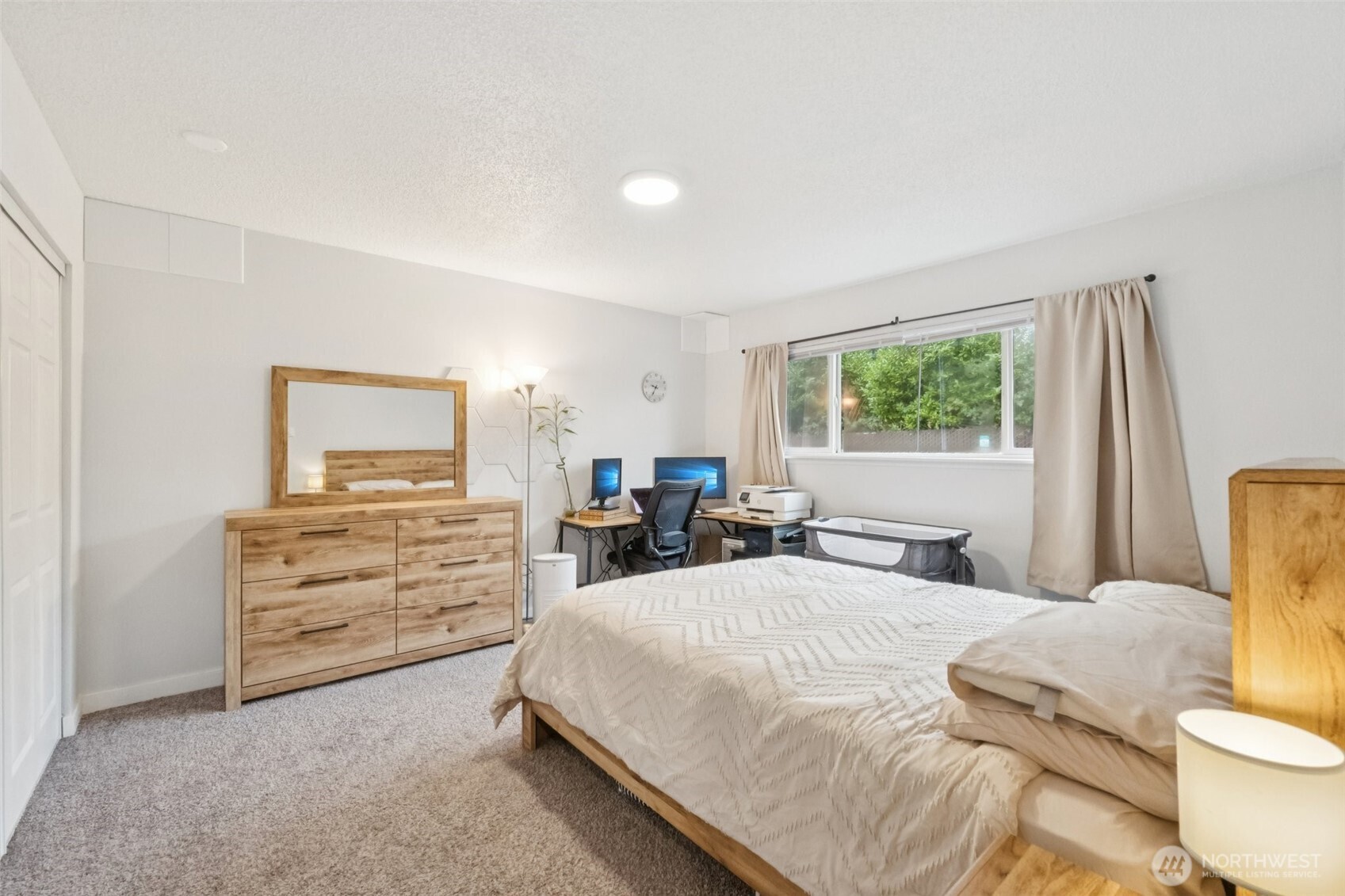 9623 South 248th Street, Unit G5 Kent, WA 98030 - Photo 12 of 23 a bedroom with a bed and a dresser