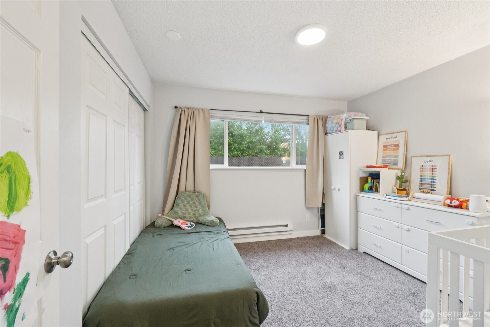 9623 South 248th Street, Unit G5 Kent, WA 98030 - Photo 13 of 23 a view of a room with window and cabinet