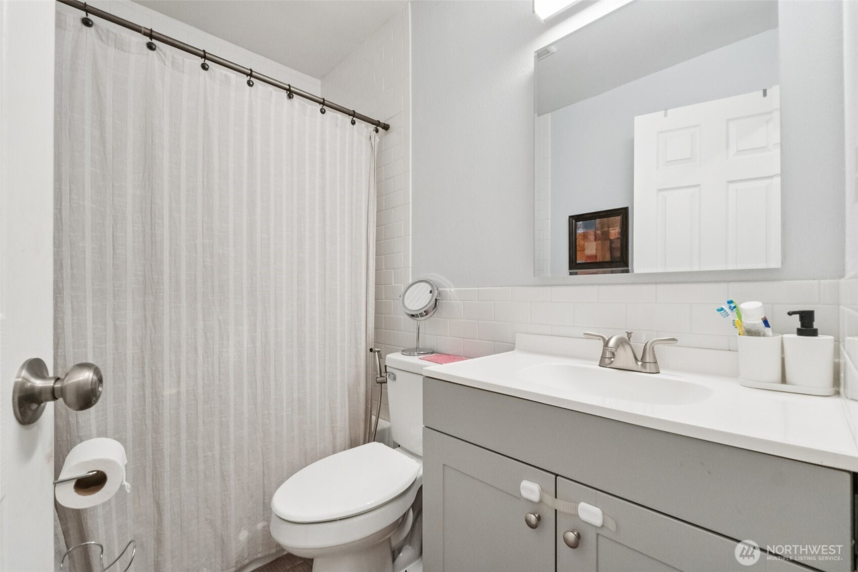 9623 South 248th Street, Unit G5 Kent, WA 98030 - Photo 14 of 23 a bathroom with a sink a toilet and shower