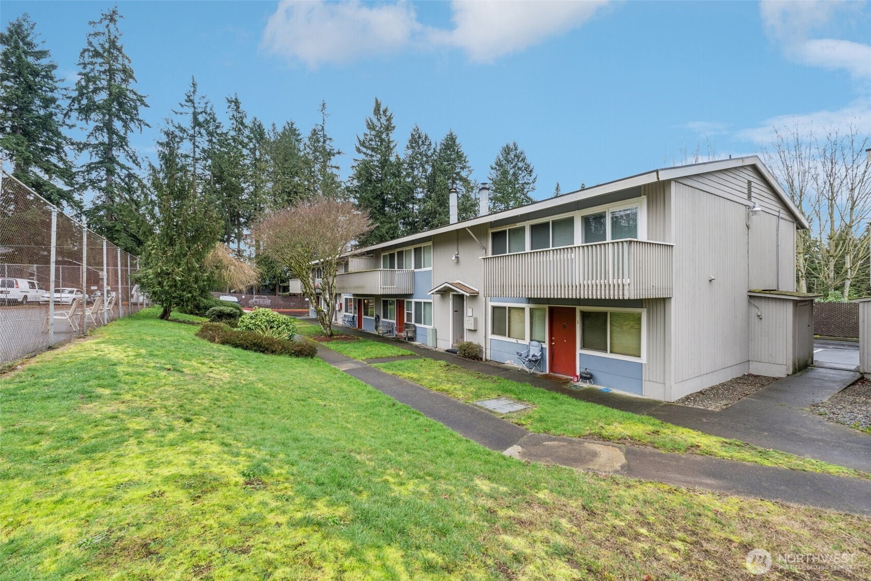 9623 South 248th Street, Unit G5 Kent, WA 98030 - Photo 15 of 23 a front view of a house with garden