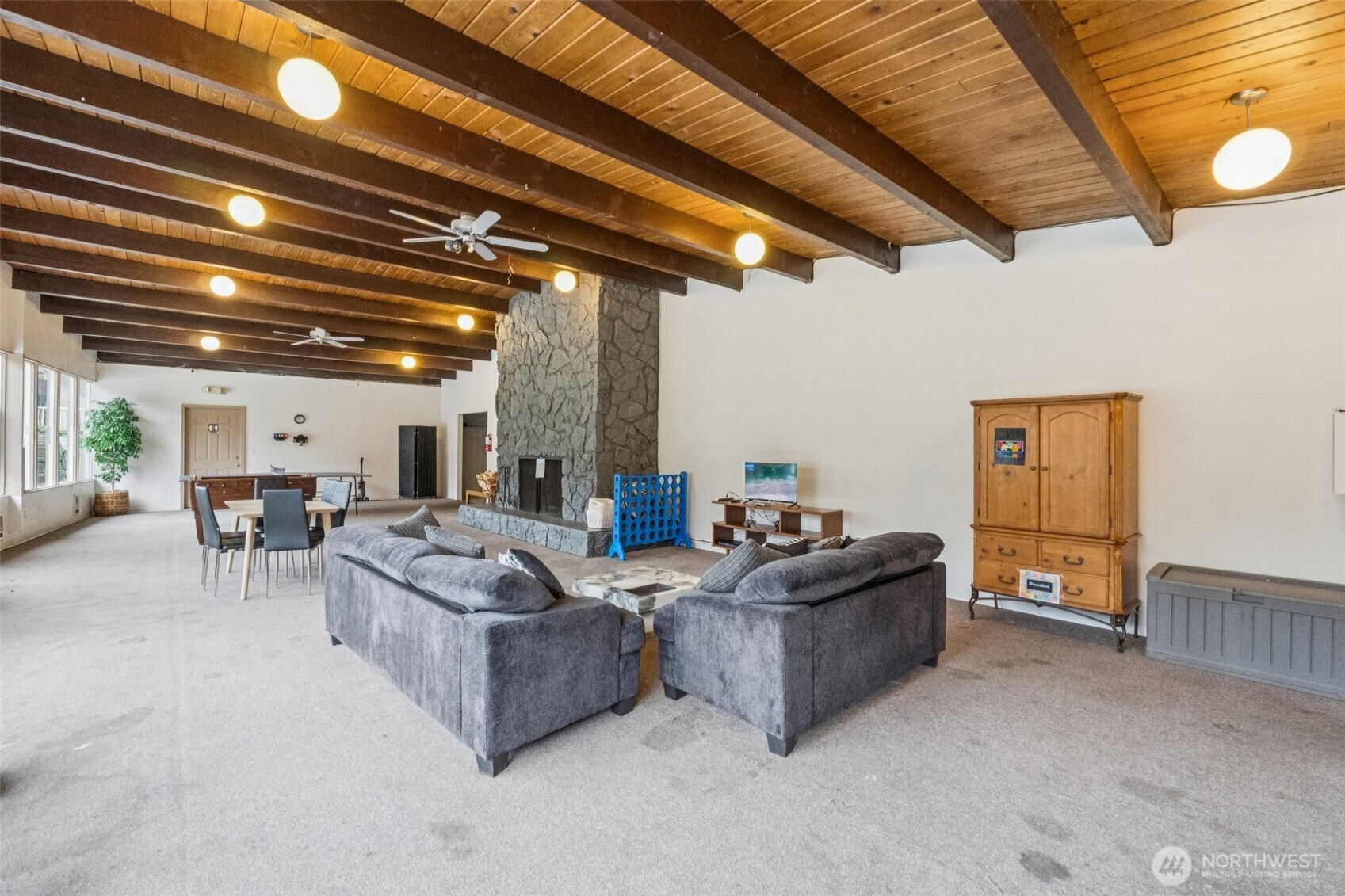 9623 South 248th Street, Unit G5 Kent, WA 98030 - Photo 17 of 23 a living room with furniture and a chandelier