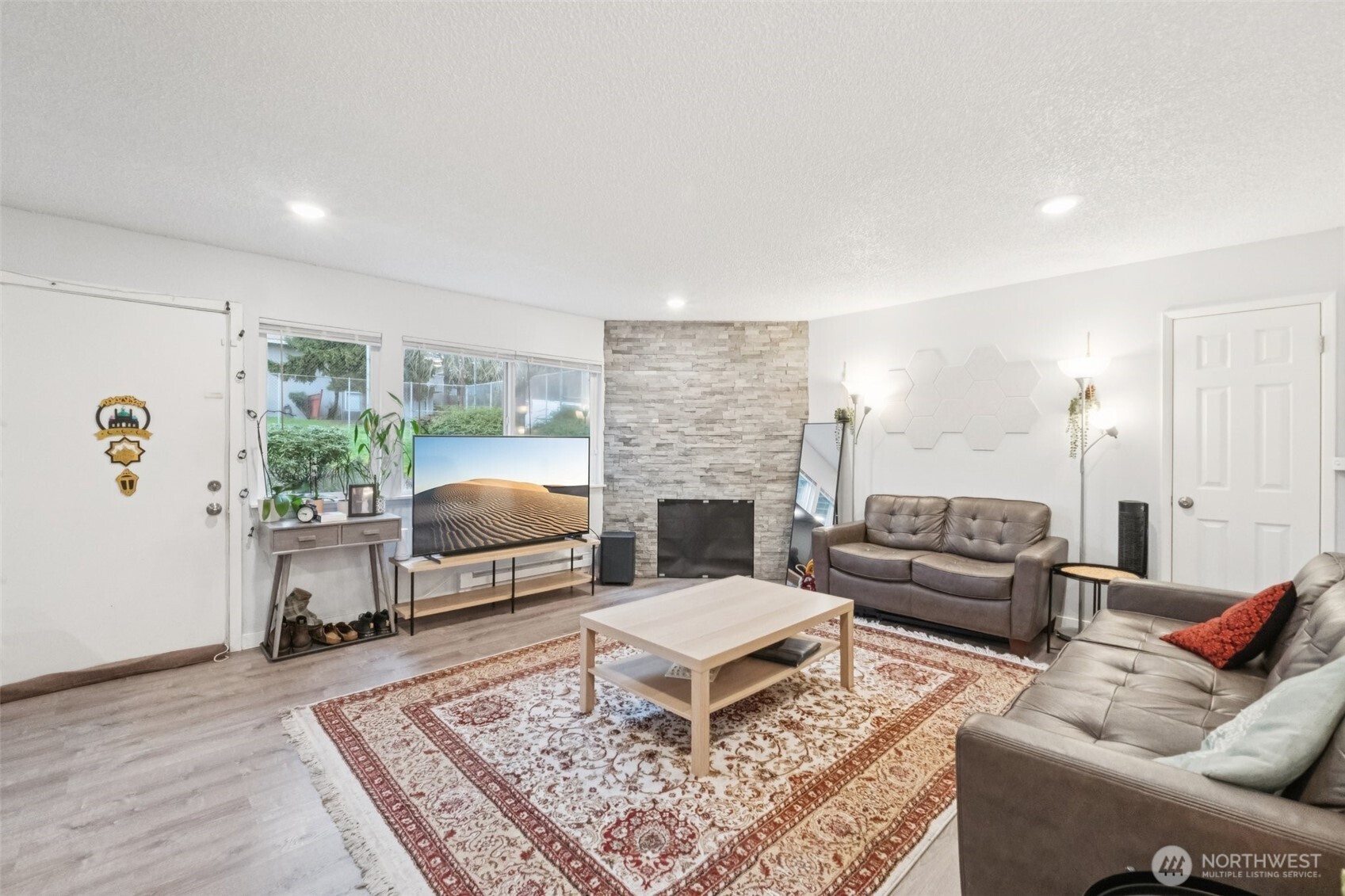 9623 South 248th Street, Unit G5 Kent, WA 98030 - Photo 2 of 23 a living room with furniture and a rug