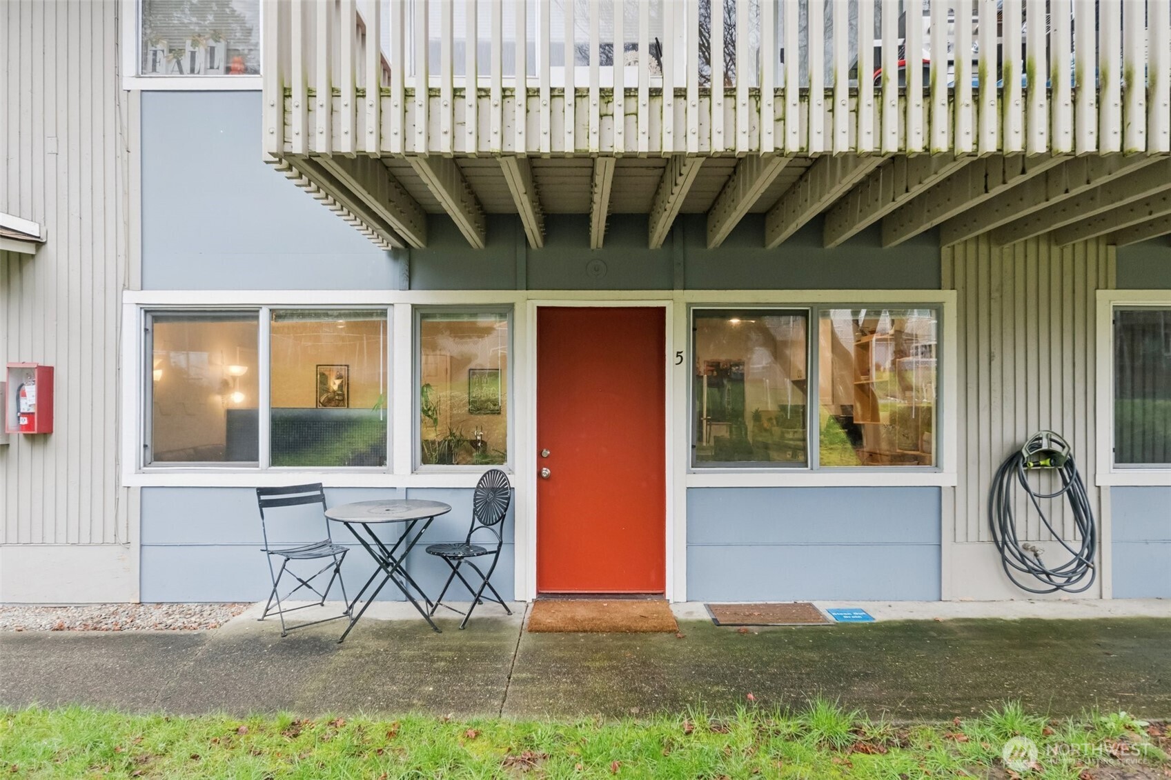 9623 South 248th Street, Unit G5 Kent, WA 98030 - Photo 23 of 23 a front view of a house with backyard porch and furniture