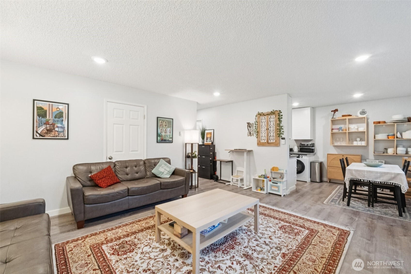 9623 South 248th Street, Unit G5 Kent, WA 98030 - Photo 4 of 23 a living room with furniture rug and wooden floor