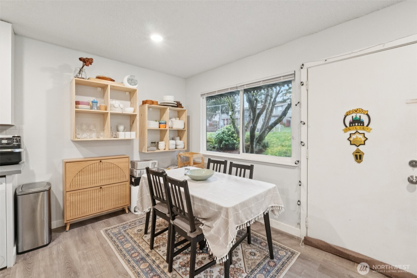 9623 South 248th Street, Unit G5 Kent, WA 98030 - Photo 6 of 23 a view of a dining room with furniture window and outside view