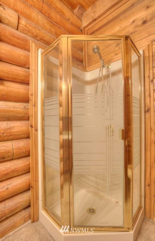 24107 Brooks Road East Orting, WA 98360 - Photo 13 of 40 a bathroom with a glass door shower