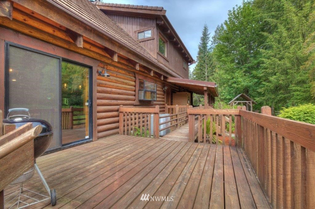 24107 Brooks Road East Orting, WA 98360 - Photo 21 of 40 a front view of a house with barbeque oven and furniture