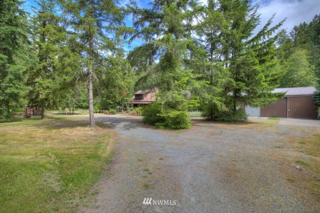 24107 Brooks Road East Orting, WA 98360 - Photo 24 of 40 a view of a road with trees