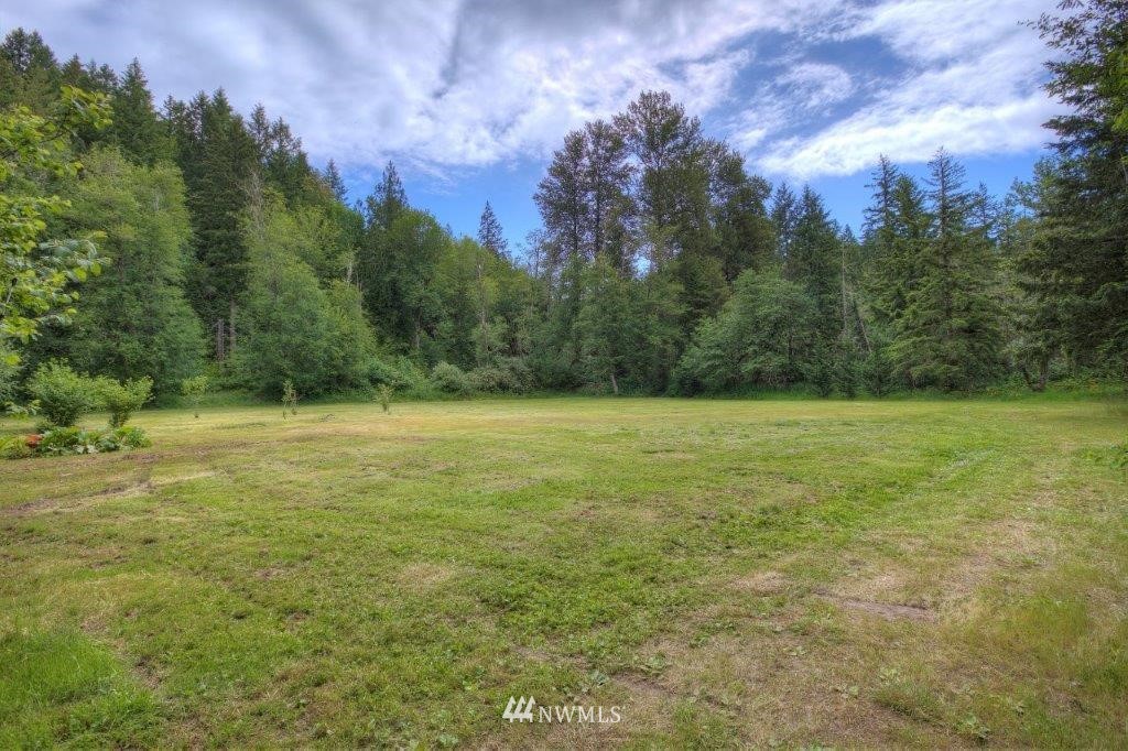 24107 Brooks Road East Orting, WA 98360 - Photo 39 of 40 a view of a yard with a house in the background