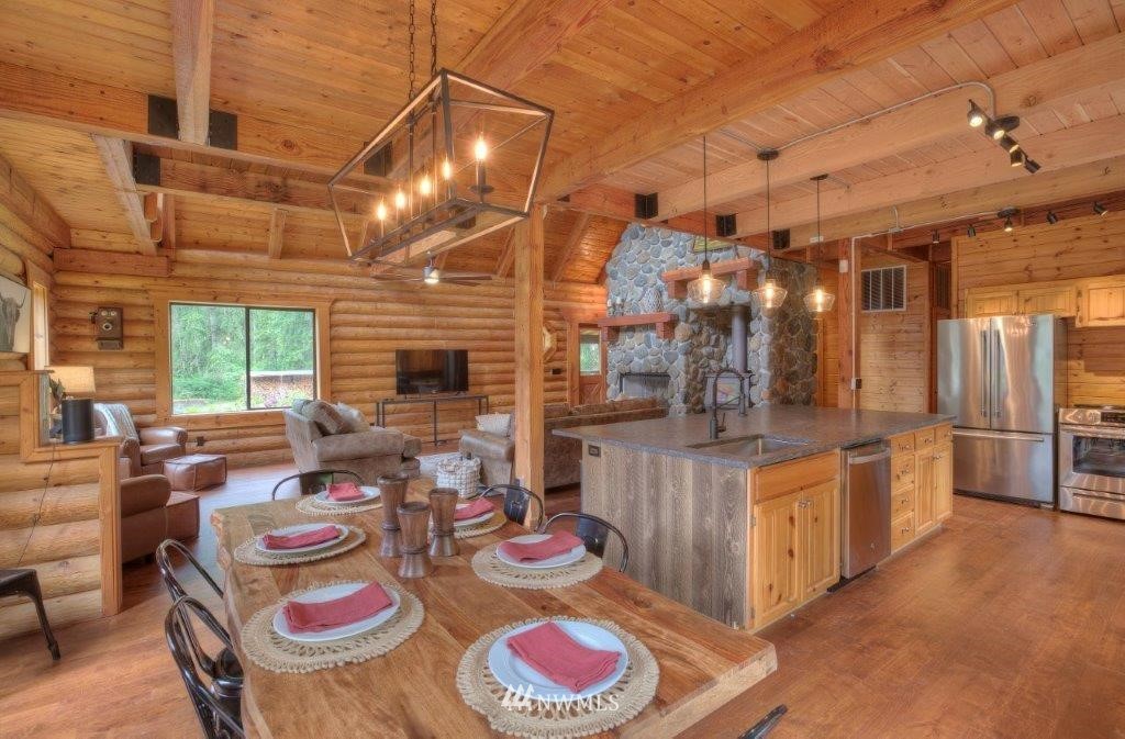 24107 Brooks Road East Orting, WA 98360 - Photo 6 of 40 a kitchen with stainless steel appliances granite countertop a sink and cabinets