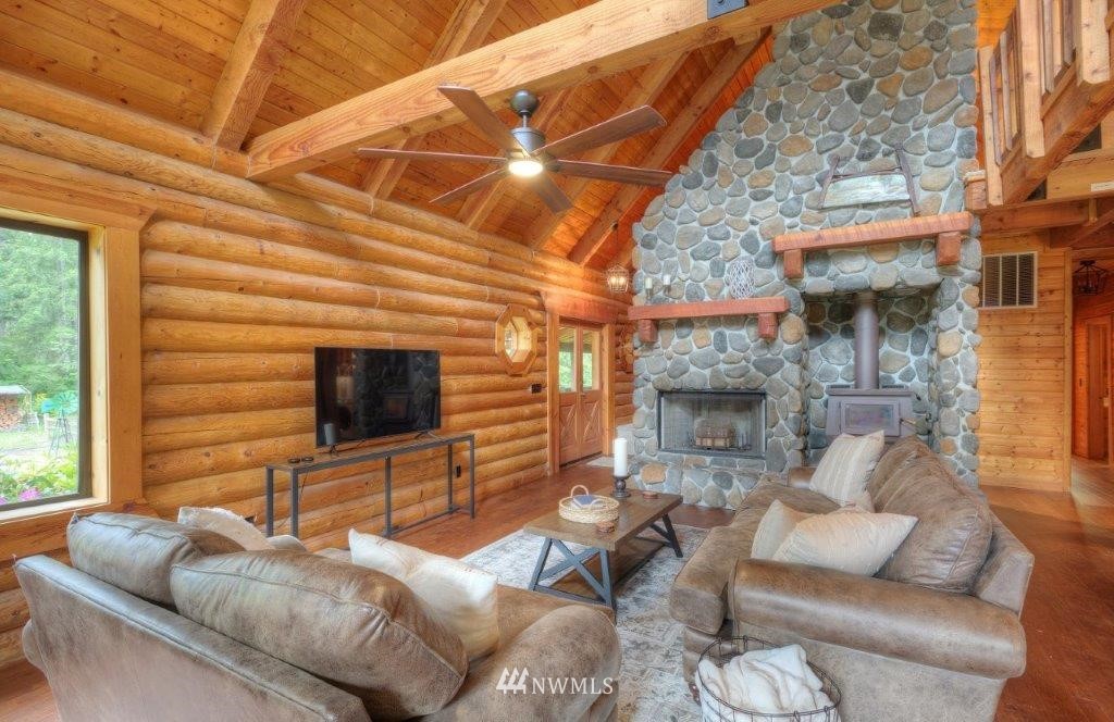 24107 Brooks Road East Orting, WA 98360 - Photo 8 of 40 a living room with furniture and a flat screen tv