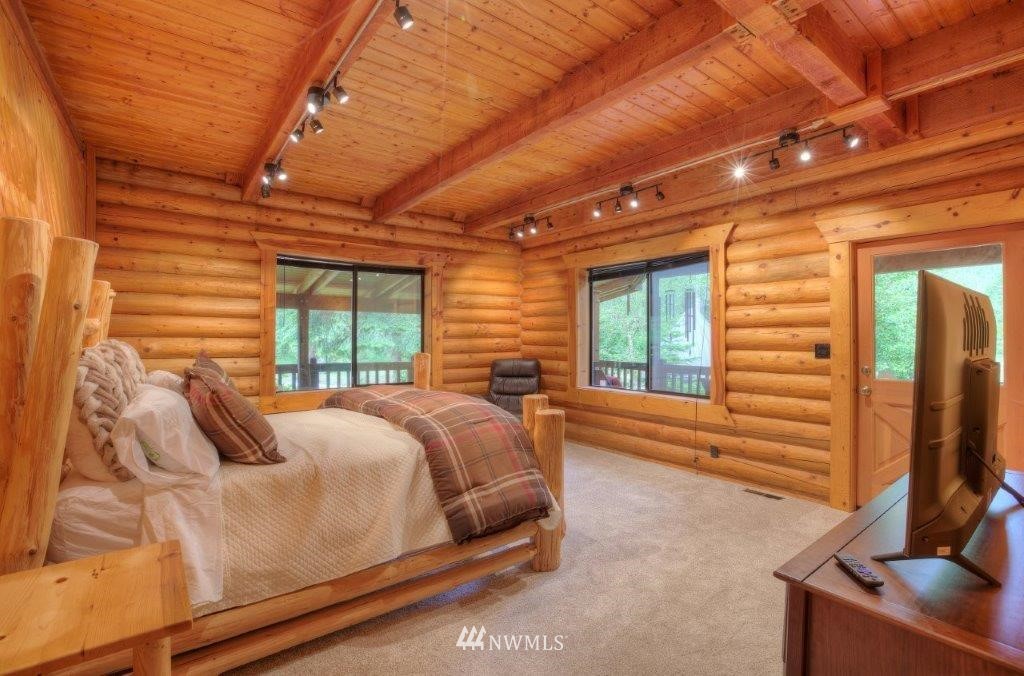 24107 Brooks Road East Orting, WA 98360 - Photo 9 of 40 a bed sitting in a room next to a window