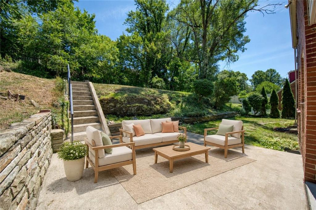 1823 Bower Hill Road Pittsburgh, PA 15243 - Photo 23 of 31 The expansive patio provides an inviting place to enjoy morning coffee, peaceful surroundings, or gatherings with friends.