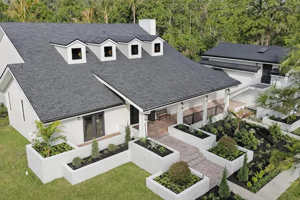 a aerial view of a house with a yard