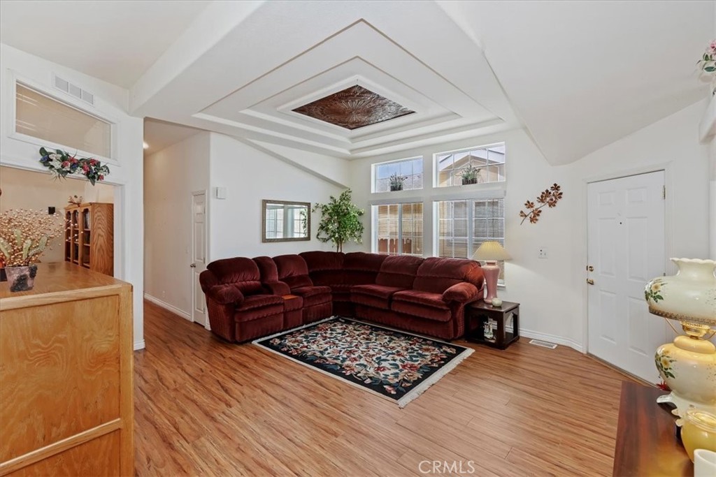 27250 Murrieta Road, Unit 298 Menifee, CA 92586 - Photo 13 of 54 a living room with furniture and a rug