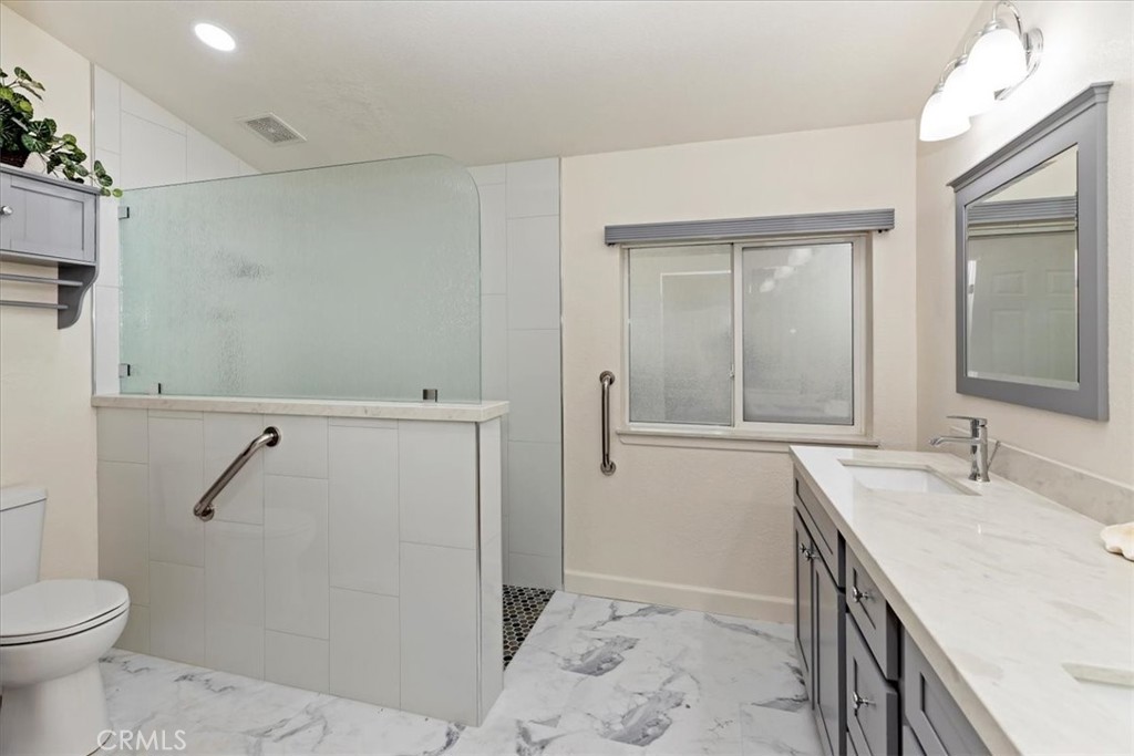 27250 Murrieta Road, Unit 298 Menifee, CA 92586 - Photo 27 of 54 a bathroom with a sink a toilet and shower