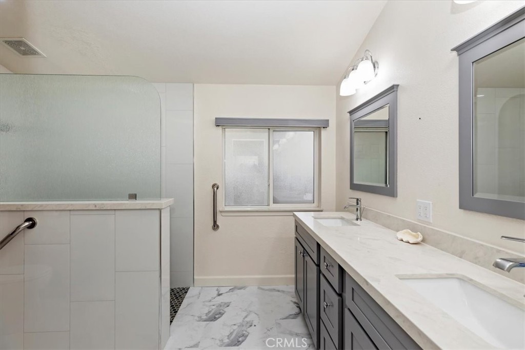 27250 Murrieta Road, Unit 298 Menifee, CA 92586 - Photo 29 of 54 a bathroom with a sink a vanity and a mirror