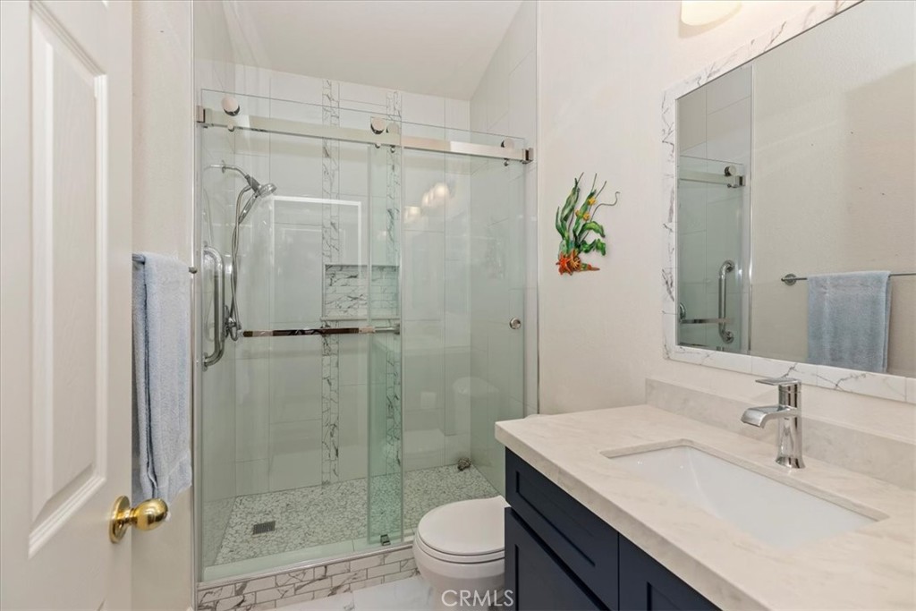 27250 Murrieta Road, Unit 298 Menifee, CA 92586 - Photo 32 of 54 a bathroom with a sink toilet and shower