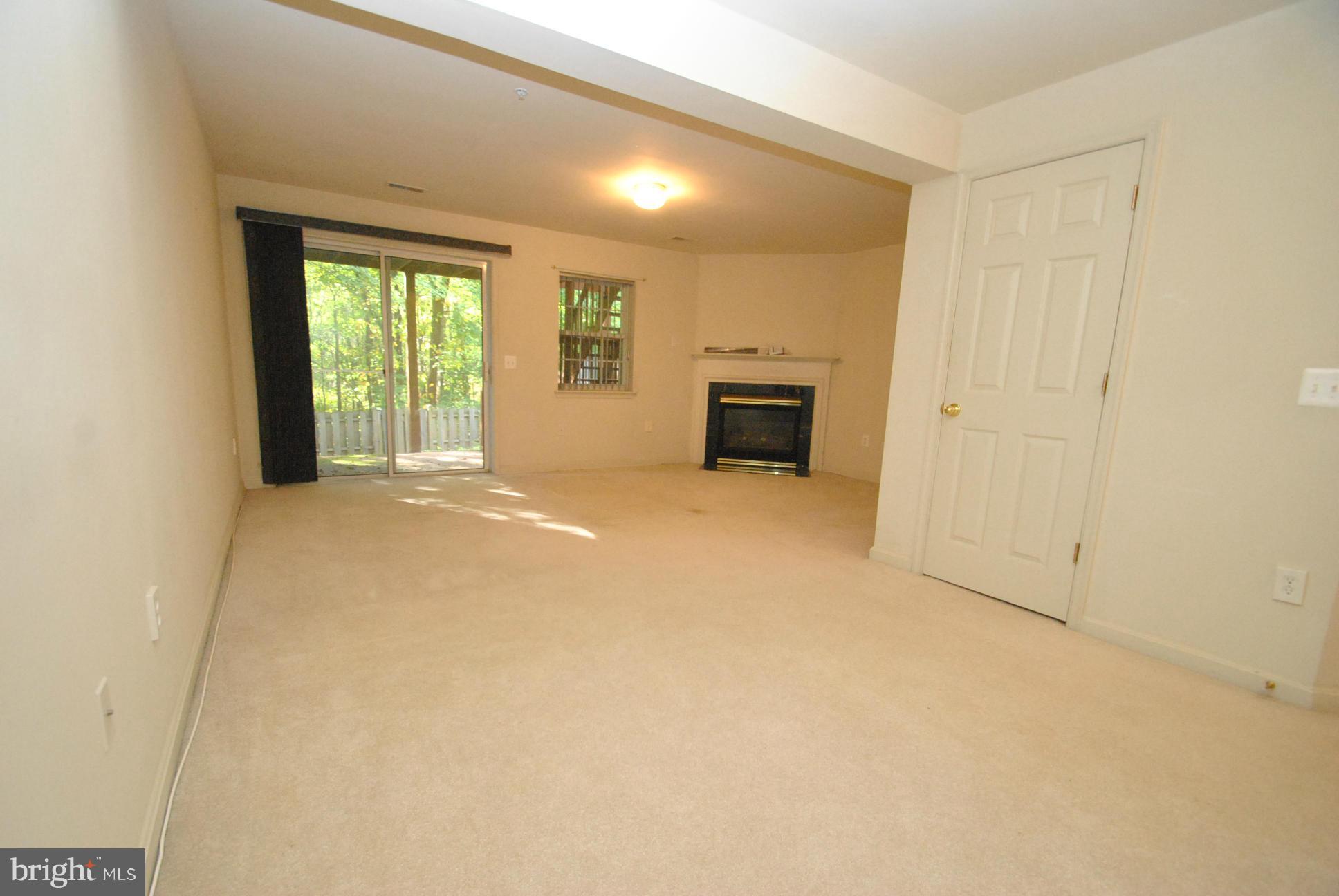6604 Ridgeborne Drive Baltimore, MD 21237 - Photo 21 of 23 FULLY FINISHED WALKOUT BASEMENT W/FIREPLACE