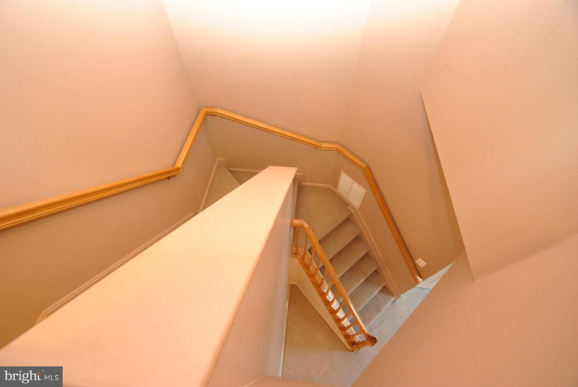 6604 Ridgeborne Drive Baltimore, MD 21237 - Photo 9 of 23 VIEW OF INTERIOR STAIRS FROM UPPER LEVEL