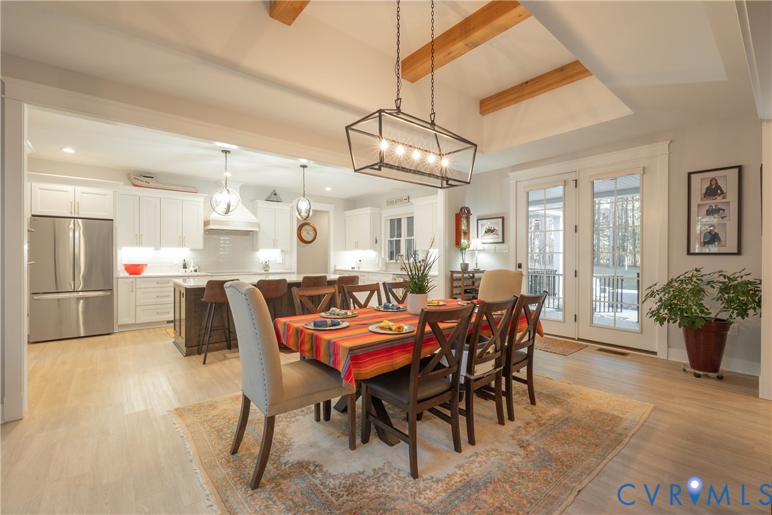 2591 Shaughnessy Road Powhatan, VA 23139 - Photo 18 of 50 a view of a dining room with furniture and chandelier