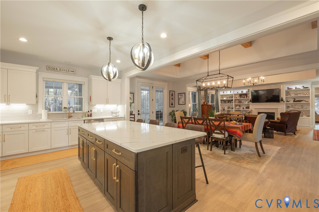 2591 Shaughnessy Road Powhatan, VA 23139 - Photo 24 of 50 a large kitchen with a counter space a sink appliances and living room view