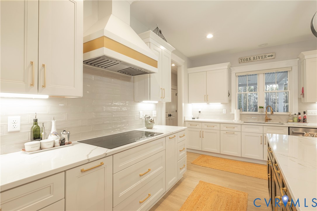 2591 Shaughnessy Road Powhatan, VA 23139 - Photo 28 of 50 a kitchen with granite countertop white cabinets and white appliances
