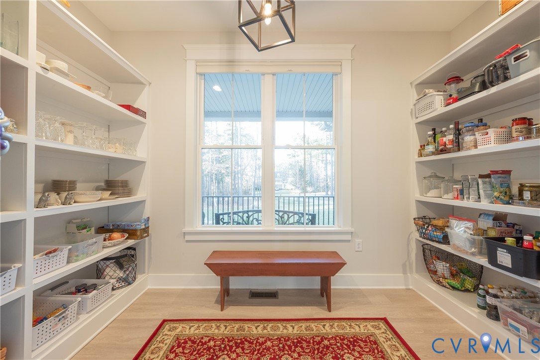 2591 Shaughnessy Road Powhatan, VA 23139 - Photo 29 of 50 a room with lots of books and a table